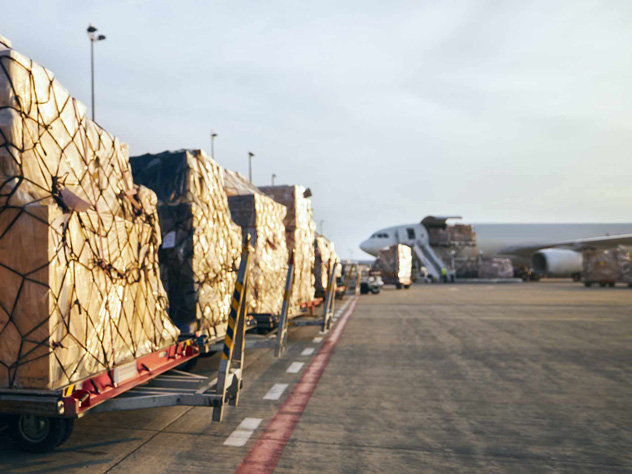 View airside cargo in front of a plane